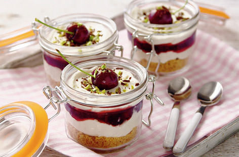 Bursting with sweet cherry compote, these no-bake cheesecakes are topped off with chocolate and pistachio nuts.  Find more dessert ideas at Tesco Real Food